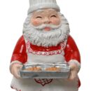 Χριστουγεννιάτικο στολίδι Άγιος Βασίλης που χαμογελά και κρατά έναν δίσκο με κουλουράκια. Φορά καπέλο μάγειρα και λευκή ποδιά.