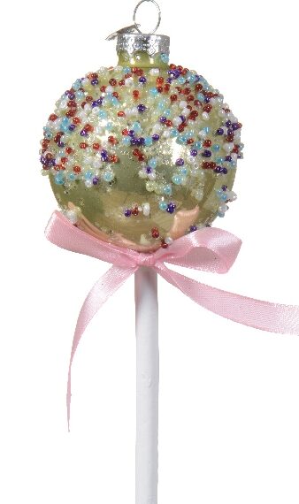 Στολίδι σε σχήμα cake pop χρώματος λεμονί. Διακόσμηση με μωβ, γαλάζιες, κόκκινες και λευκές χάντρες. Στο λευκό ξυλάκι είναι δεμένος ένας ροζ φιόγκος.