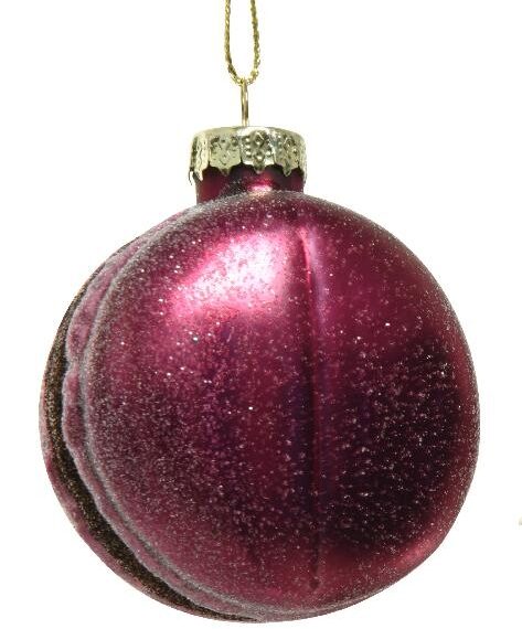 Χριστουγεννιάτικο στολίδι, χρώματος φούξια, σε σχήμα μακαρόν με καφέ γέμιση. Κρέμεται με χρυσή κλωστή. Η επιφάνεια έχει αραιή στρώση γκλίτερ.